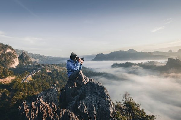 Photographer composing an outdoor shot